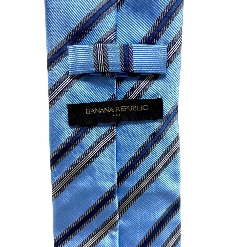 Banana Republic dress tie blue with grey stripes. 100% Silk